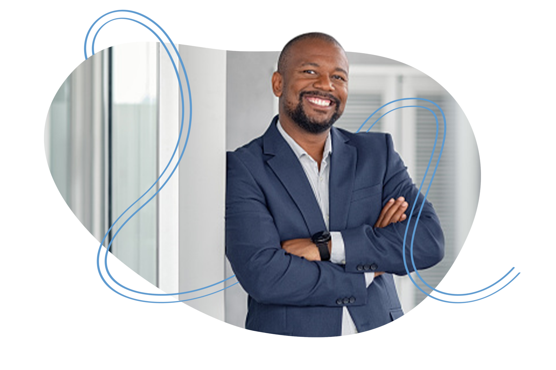 Smiling male wearing a blazer in a bright work environment